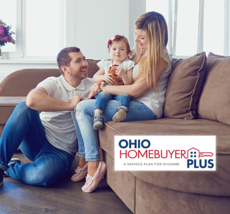 happy family of 3 sitting on couch in new home purchased with Ohio Homebuyer Plus Savings from 1st national Bank